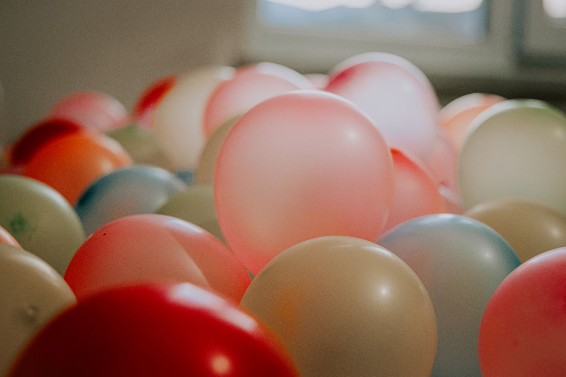 A festive birthday party table with balloons and decorations