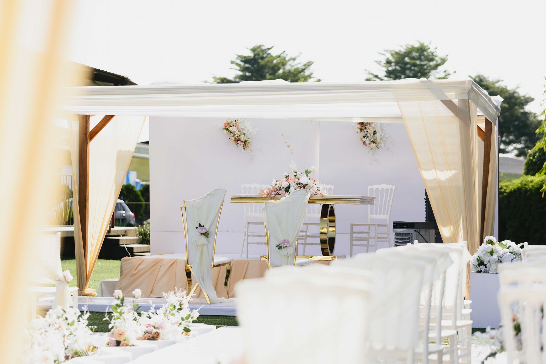 An elegant outdoor wedding ceremony at golden hour
